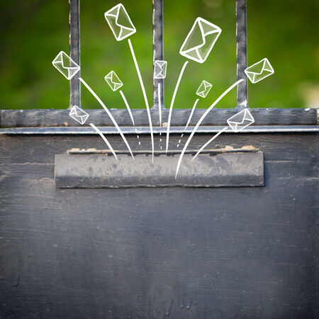 Hand drawn letters and envelopes comming out of a mailboxの写真素材