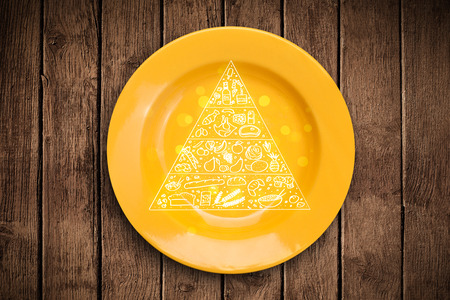 Hand drawn food pyramid on colorful dish plate and grungy backgroundの写真素材
