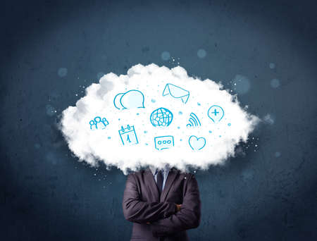 Man in suit with cloud head and blue icons on grungy backgroundの写真素材