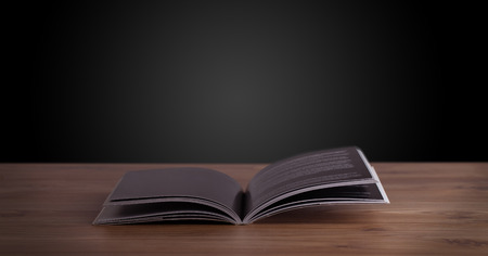 Open book on wooden deck and copy space