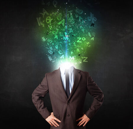 Business man with abstract glowing letters on head conceptの写真素材