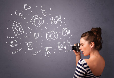 Young photographer girl shooting photography iconsの写真素材
