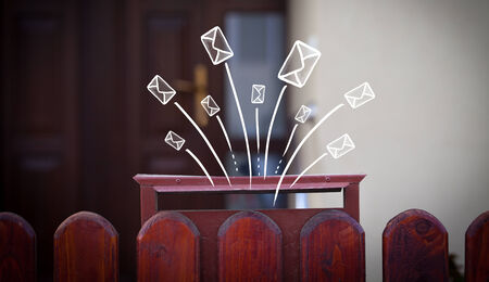 Hand drawn letters and envelopes comming out of a mailboxの写真素材