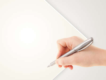 Hand writing on plain empty white paper copy space with penの写真素材
