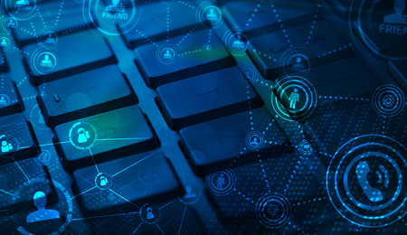 Computer keyboard with glowing icons, social networking concept
