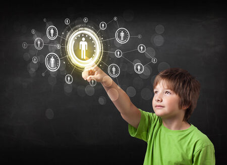 Modern boy touching future technology social network buttonの写真素材