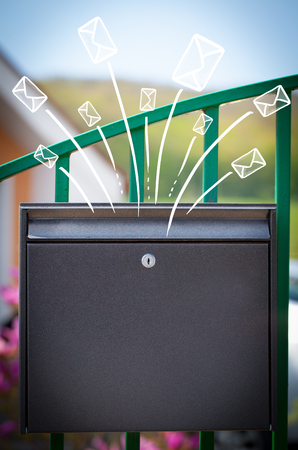 Hand drawn letters and envelopes comming out of a mailboxの写真素材
