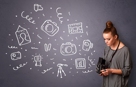 Young photographer girl shooting photography iconsの写真素材