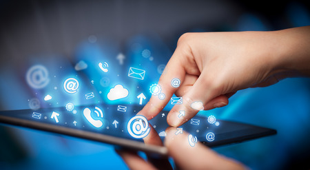 Finger pointing on tablet pc, social media conceptの写真素材