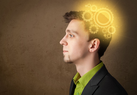 Young person thinking with a glowing machine head illustrationの写真素材