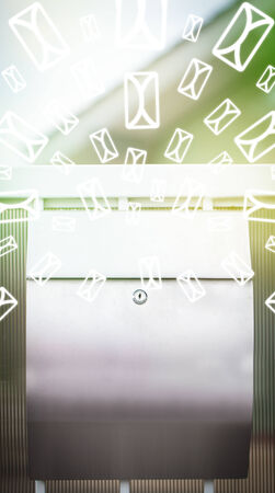 Mailbox with letter icons exploding on glowing green backgroundの写真素材