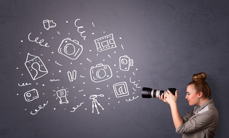 Young photographer girl shooting photography iconsの写真素材