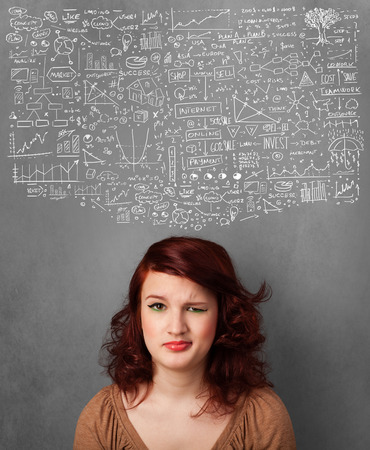 Thoughtful young woman with sketched charts over her headの写真素材