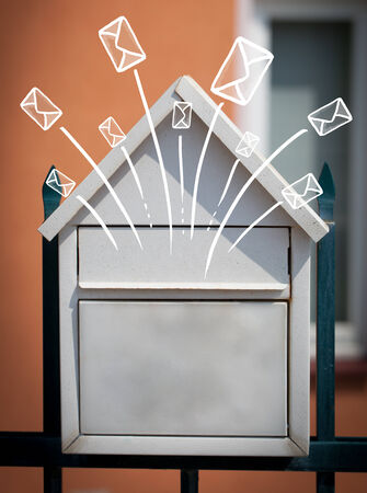 Hand drawn letters and envelopes comming out of a mailboxの写真素材
