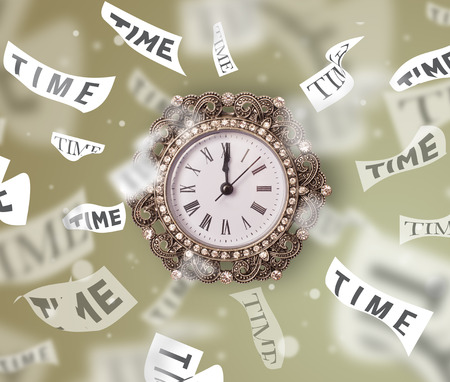 Clock and watch concept with time flying away on paperの写真素材