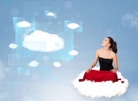 Happy young girl looking at modern cloud networkの写真素材