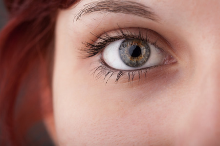 Beautiful portrait of a pretty girl close up eyeの写真素材
