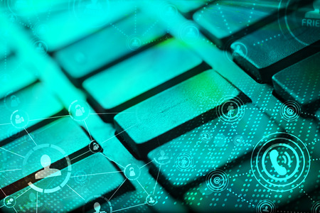Computer keyboard with glowing icons, social networking conceptの写真素材