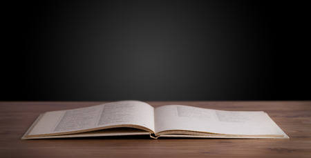 Open book on wooden deck and copy spaceの写真素材