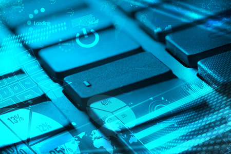 Computer keyboard with glowing charts, digital marketing concept