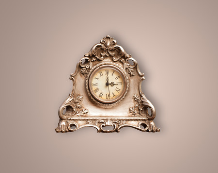Vintage old clock with showing preicse time on the wall