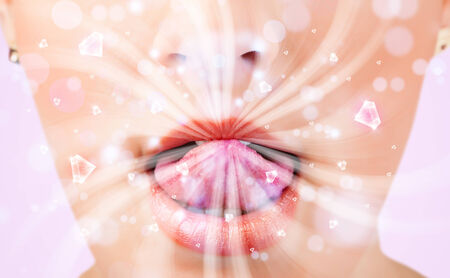 Beautiful girl mouth breathing abstract white lights and crystals close upの写真素材