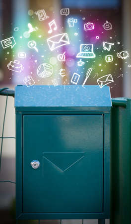 Colorful modern icons and symbols bursting out of a mailboxの写真素材