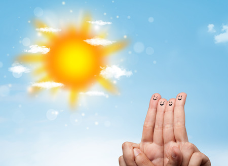 Cheerful happy smiling fingers with bright sun and clouds illustrationの写真素材