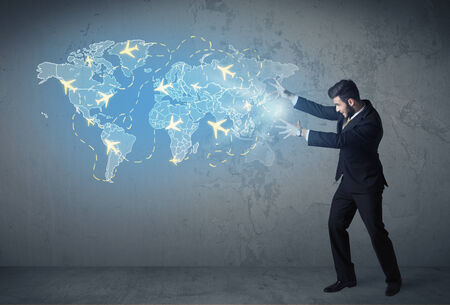 Business person showing digital blue map with planes around the world conceptの写真素材