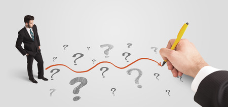 Business man looking at question marks and solution path concept drawn by handの写真素材