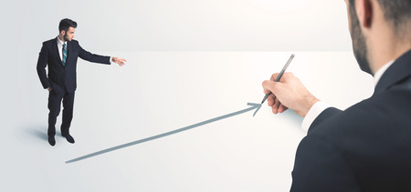 Business person looking at line drawn by hand concept on backgroundの写真素材