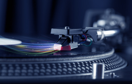 Music player playing vinyl music with colourful abstract lines concept on background