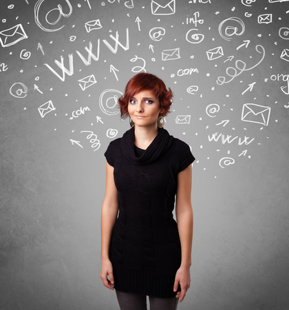 Pretty young girl with abstract white media icon doodles on gradient backgroundの写真素材