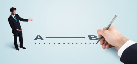 Businessman looking at red line from a to b drawn by hand concept on backgroundの写真素材