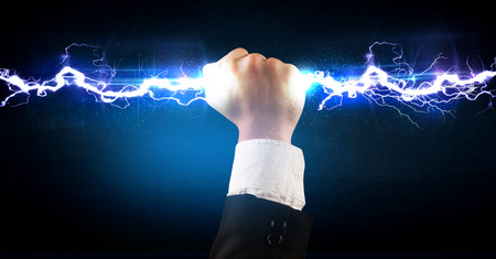 Business man holding electricity light bolt in his hands concept Business man holding electricity light bolt in his hands concept