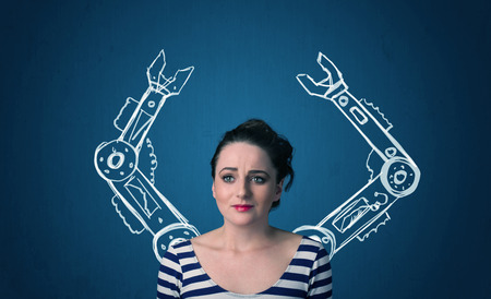 Pretty young woman with robotic arms conceptの写真素材