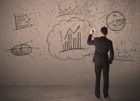Businessman drawing a business project on a wallの写真素材