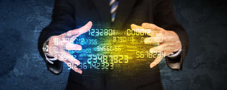 Businessman holding a shining number cloud in front of his body