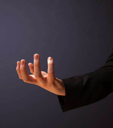 Businessman presenting empty spaceの写真素材