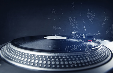 Turntable playing music with hand drawn cross lines concept on backgroundの写真素材