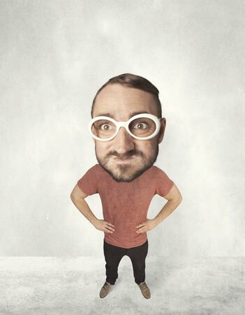Funny person with big head makes jesting facial expressionの写真素材