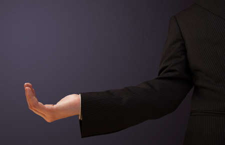 Businessman presenting empty spaceの写真素材