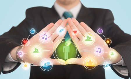 Hands creating a form with social media connection in the centerの写真素材