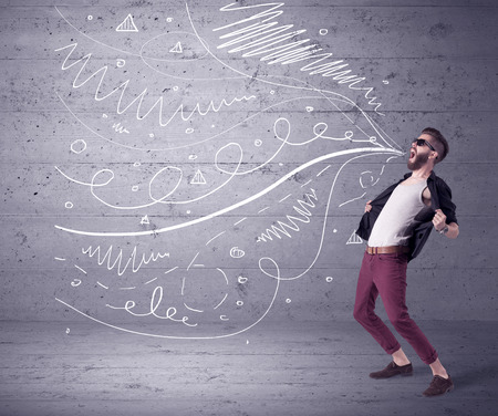 A mad hipster guy with beard shouting drawn white lines, curves on concrete urban wall illustration background conceptの写真素材
