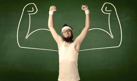 A young man with beard and glasses posing in front of green background, imagining how he would look...