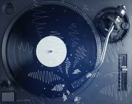 Turntable playing music with hand drawn cross lines concept on backgroundの写真素材