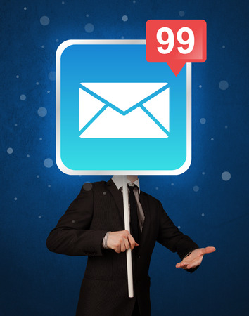 Smart businessman holding square sign with mail iconの写真素材