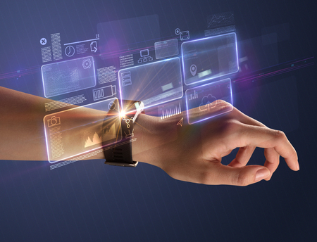 Female hand with smartwatch and  statements on.の写真素材