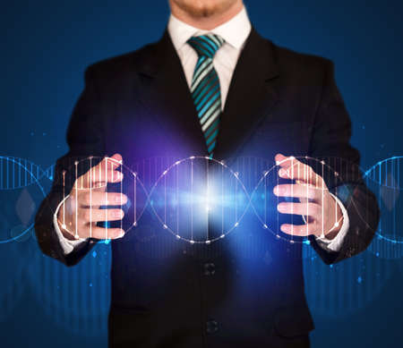 Businessman with DNA concept in his handsの写真素材