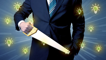 Better-looking businesman holding tool with idea bulbs concepの写真素材